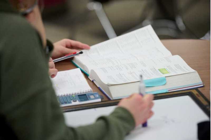 A textbook open on a desk