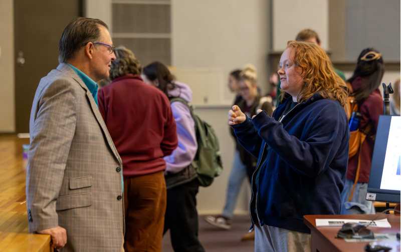 UW-La Crosse Junior Lyd Voss, right, speaks to College of Arts, Social Sciences & Humanities Dean Karl Kunkel during Psych Hour on Oct. 24 after Kunkel presented. Voss says Psych Hour has helped her build relationships with students, faculty and staff in the Psychology Department and beyond. 
