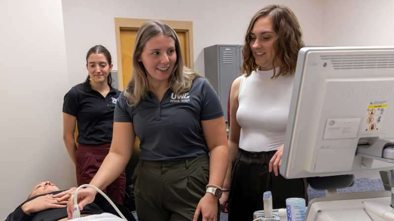 UWL students practice conducting an ultrasound in the EMPOWER Lab in the Health Science Center, a lab focused on improving lifespan health through the intersection of pelvic health, physical activity and longevity. Lisa VanWiel, assistant professor of Physical Therapy, at right, leads the lab and mentors student researchers. 