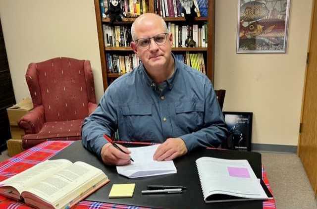 Sam Scinta at his writing desk