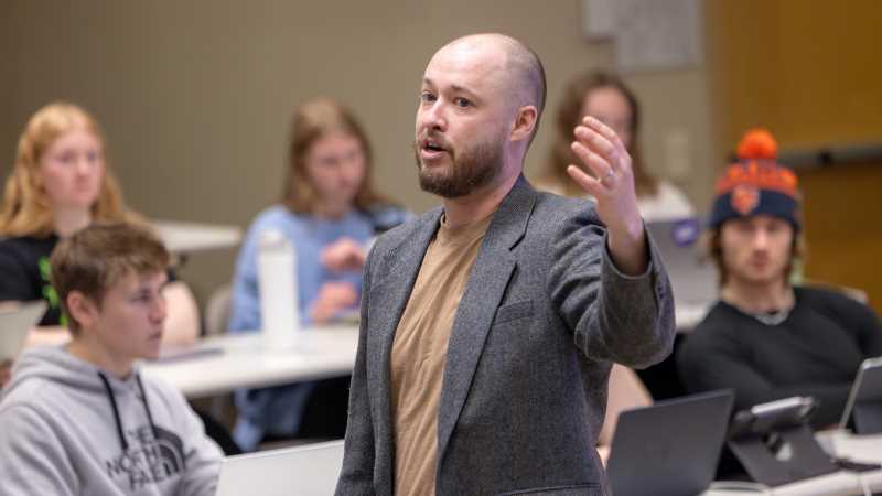 Shane Murphy, UWL assistant professor of health professions, lectures on artificial intelligence (AI) ethics during a physical therapy class.