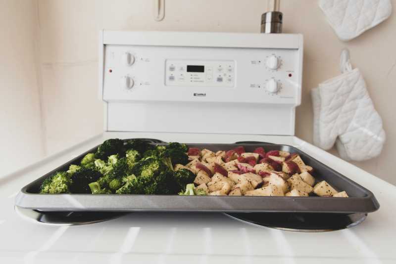 Roasting vegetables on a stovetop.