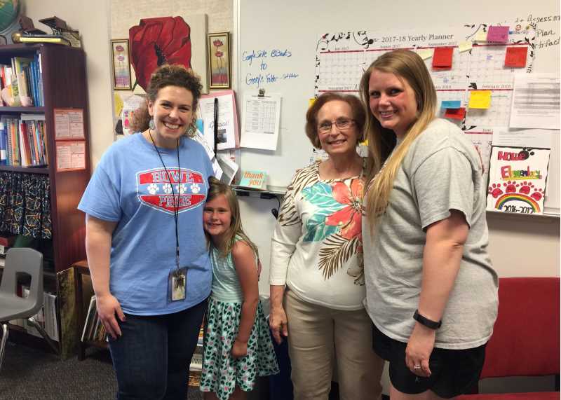 Tina Miller, '03, (left) and her mother, Donna Weber (second from right), have a unique mother-daughter tradition: Both women have served as principals in the Wisconsin Rapids public school district. Last year, Miller was named the 2021 Wisconsin Elementary Principal of the Year.