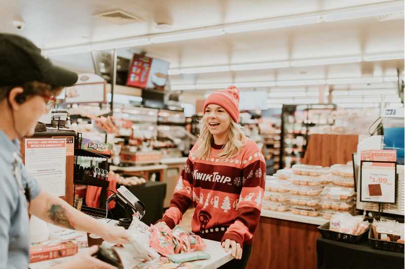 Cassandra Berger, UWL's women's lacrosse coach and a Kwik Trip superfan, visited each of the chain's 457 Wisconsin stores in 2021. “I love that it’s a one-stop shop. I can go there for gas, for groceries — even Christmas gifts,” she says. “I can go on and on about the things I love about Kwik Trip.” PHOTO CREDIT: Tatum Miller Photography