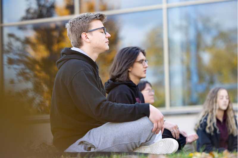 Mindfulness and meditation are forms of self-care. Here students in MIND 110: Introduction to Mindfulness sit in a circle practicing mindfulness on the UW-La Crosse campus. The class is another way the Recreation Management and Therapeutic Recreation Department is contributing to the greater goal of self-care.