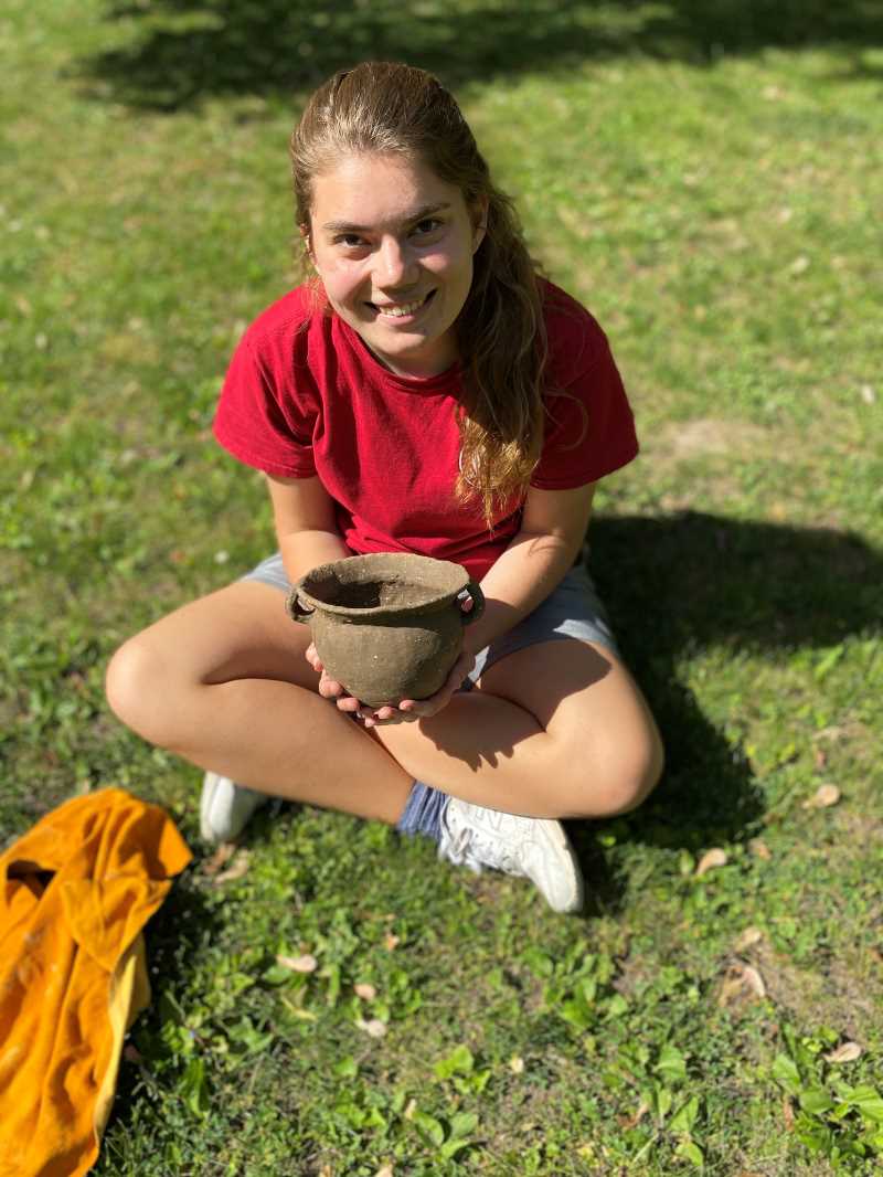 Carley Arrowood doing some experimental archaeology. 