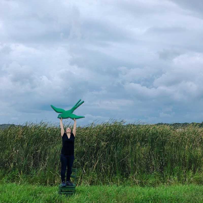 Lesli Iwai with bird piece from Dusk to Dawn sculpture