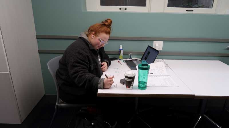 Student studying in Wittich Hall