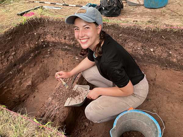 Madeline Meltesen excavating