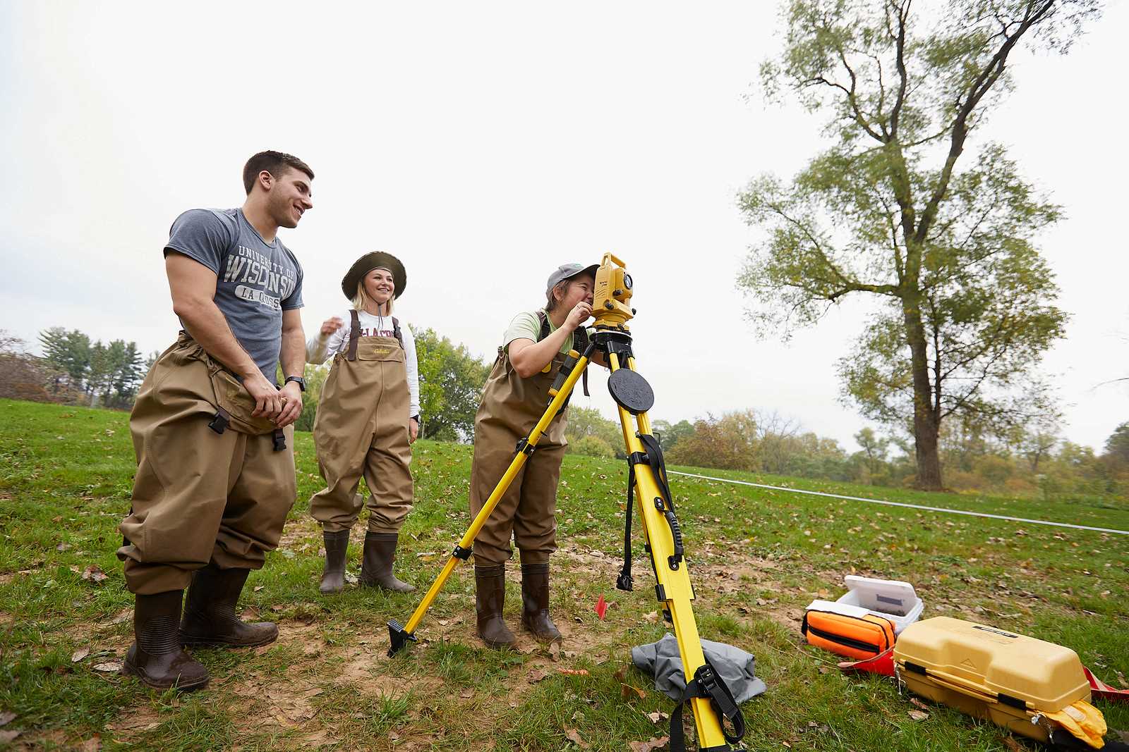 Students using surveying equipment