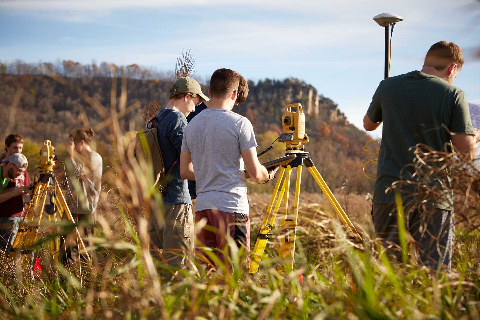 Students with using equipment in field