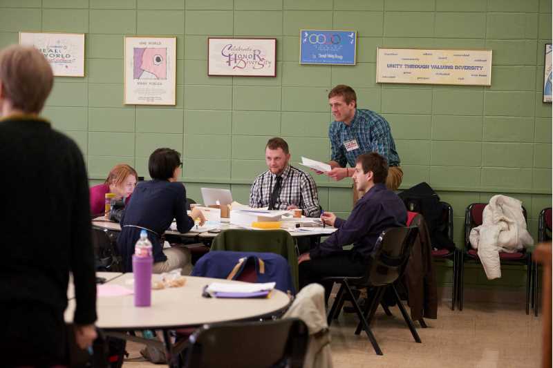 Judges sitting around a table during the 2016 National History Day at UWL