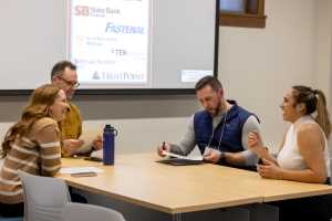 After completing their role play, competitors meet with Judges to receive feedback on their pitch