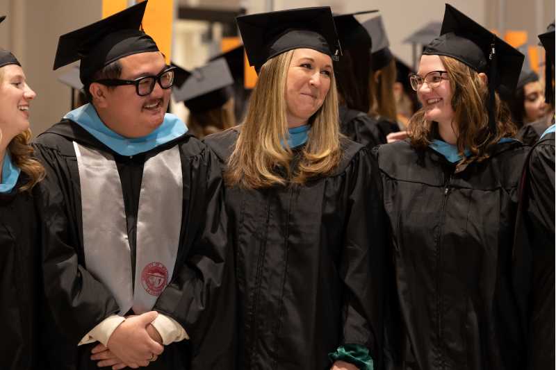 Graduates in their academic regalia participating in the Commencement Ceremony.