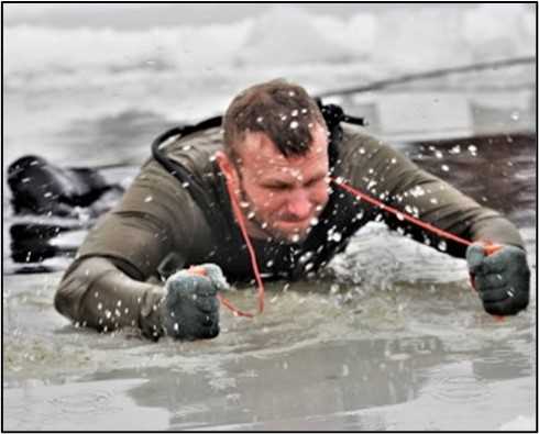 Man Climbing out of frozen lake