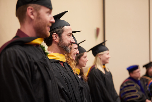 Graduate students at hooding ceremony