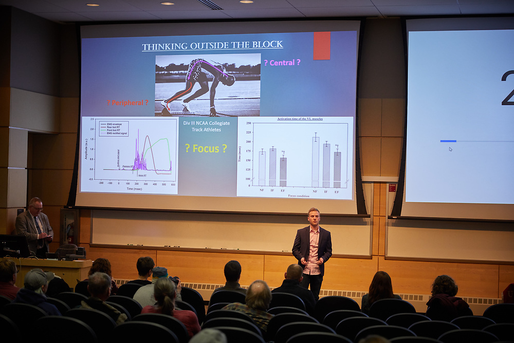 Student presenting research project for audience and judges during 3 Minute Grad Project competition