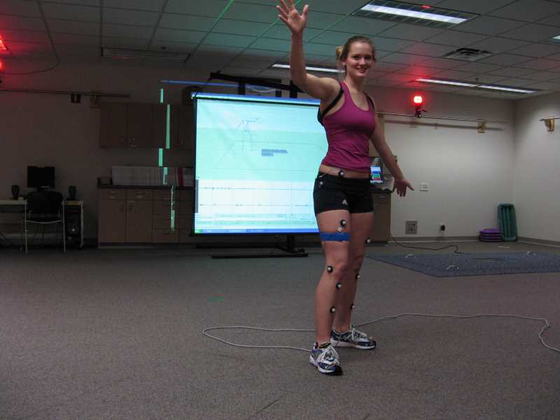 Participant in a motion analysis study.  Reflective markers are used to measure motion.