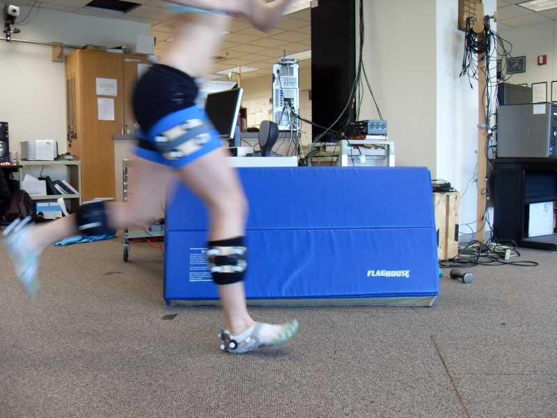 Participant running across the lab to obtain motion analysis and force plate data