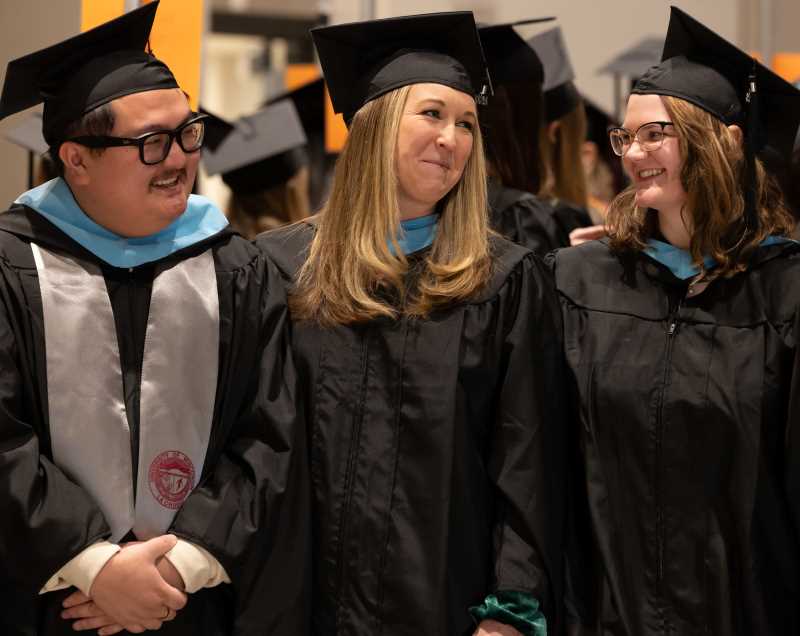 Graduates in their academic regalia participating in the Commencement Ceremony.
