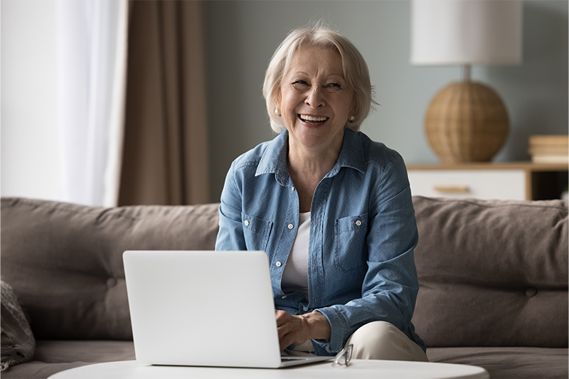 Retired woman in front of laptop computer