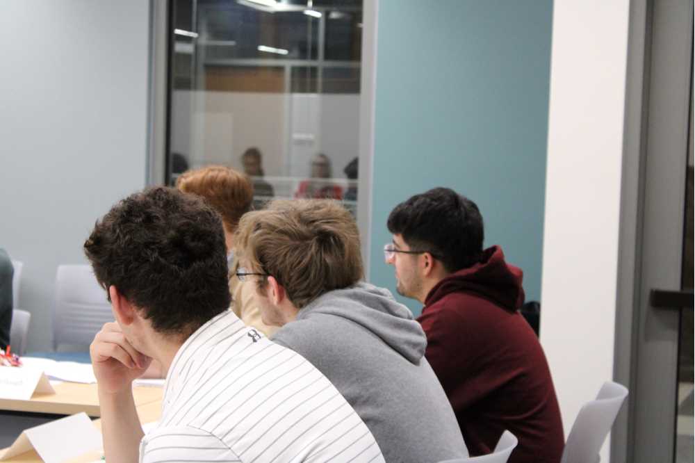 Close up of participants listening to discussion.