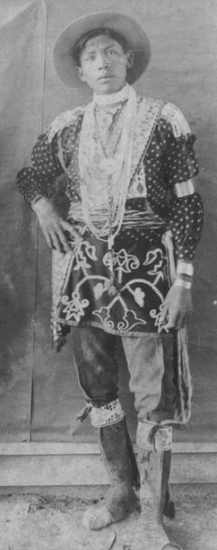 Young man wearing a finger woven sash