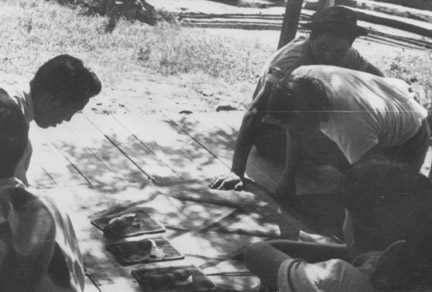 Unknown men playing the moccasin game