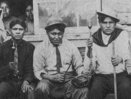 Men using drum and rattles