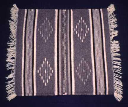 Example of a woven rug done by a young contemporary southwestern United States artist.