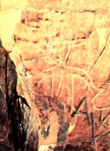 Petroglyph of a human figure wearing headgear. 