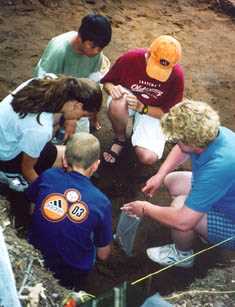 Teachers and students in the field. 