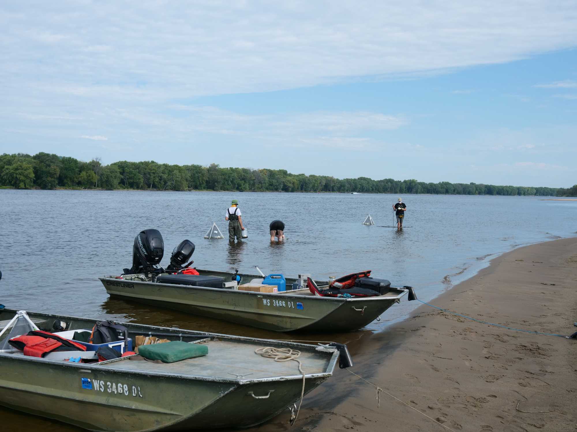 Two flat bottom boats on shore