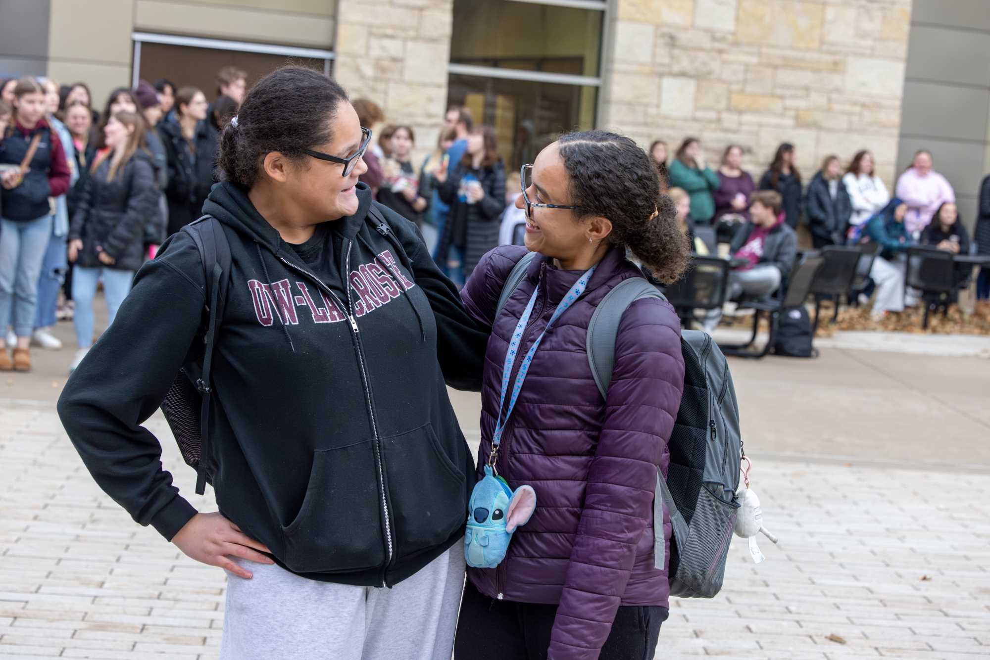 Two students at the 2025 UWL Campus Holiday Tree Lighting.