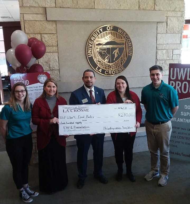 Check being presented to the 2018 penny wars winners