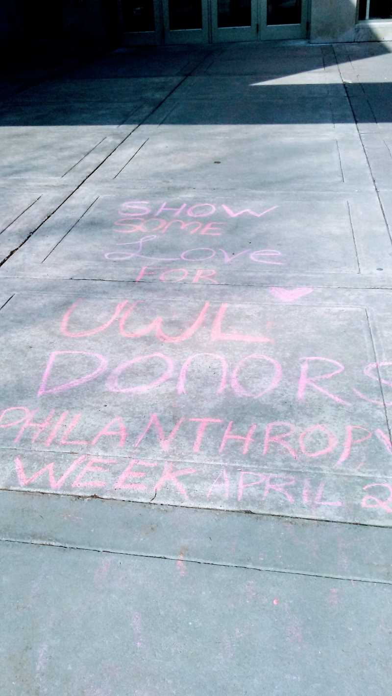 Sidewalk with chalking promoting philanthropy week