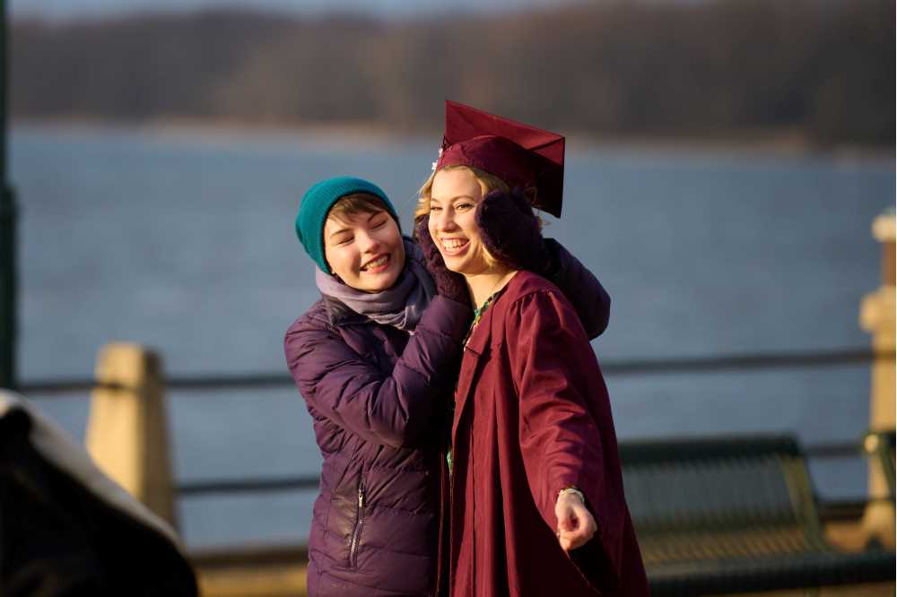 Friend warms graduate's ears