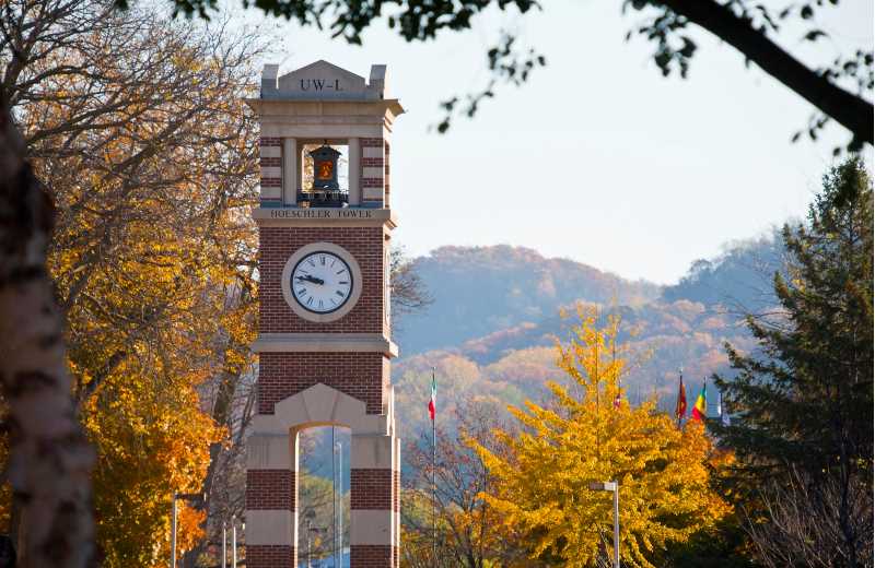 Hoeschler Clocktower among fall trees.