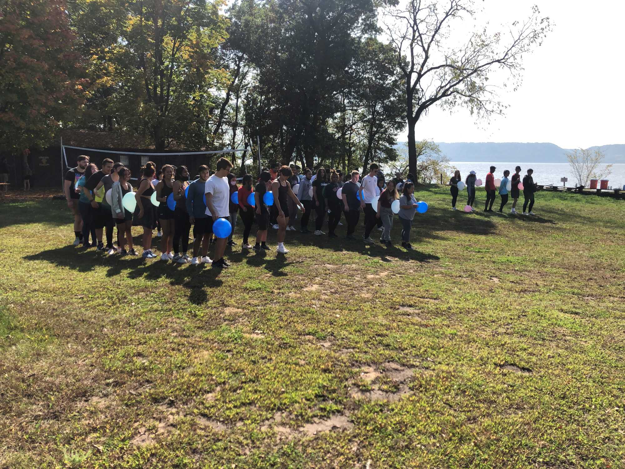 Students team bonding through balloon activity.