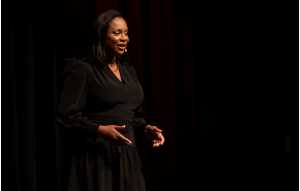 Carolyn Colleen Bostrack, author, entrepreneur and humanitarian, presents "Rewrite Your Broken Story" during the TEDxUWLaCrosse 2024 event.