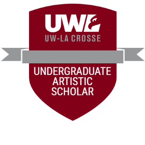 Maroon shield-shaped badge with a gray banner running through the middle. White text. The UWL logo is included at the top. The bottom reads "Undergraduate Artistic Scholar".