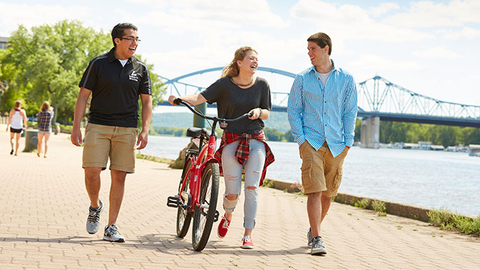 Three UWL students walking in Riverside Park.